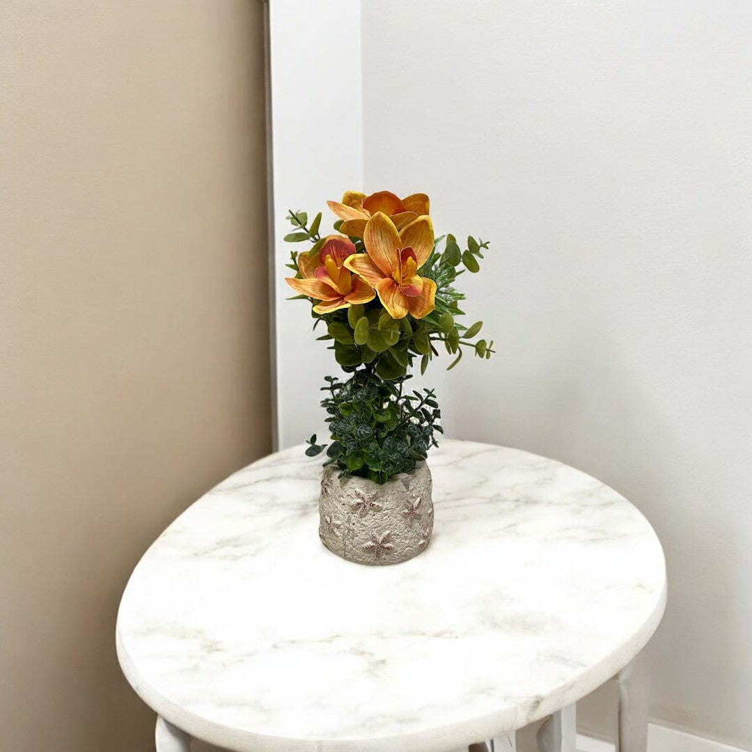 Magnolia naranja vibrante en maceta blanca | mueblesamerica.cl