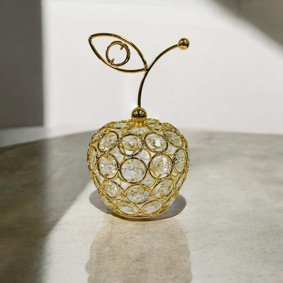 Manzana dorada con diseño estilizado | mueblesamerica.cl